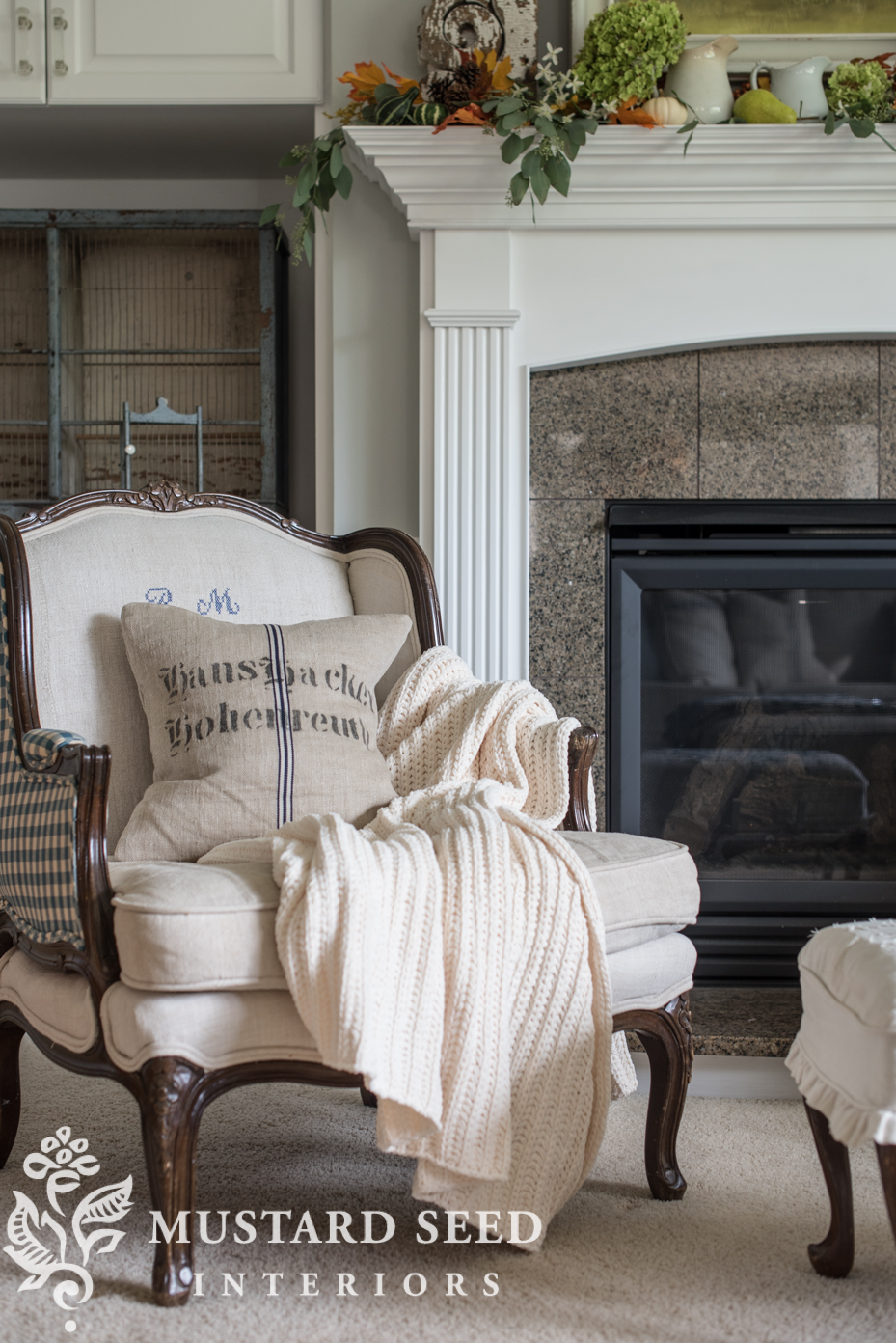 Decorating for fall in living room, chunky knit blanket. | missmustardseed.com