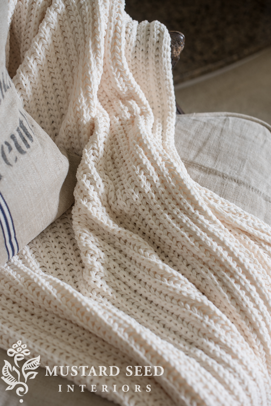 Decorating for fall in living room chunky knit blanket. | missmustardseed.com