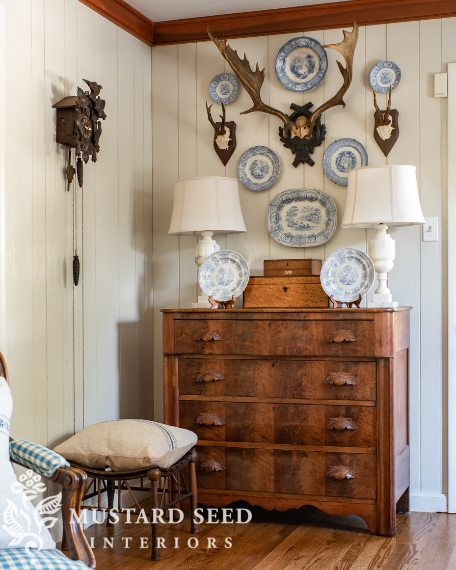 antique transferware and European stag antlers | living room | miss mustard seed