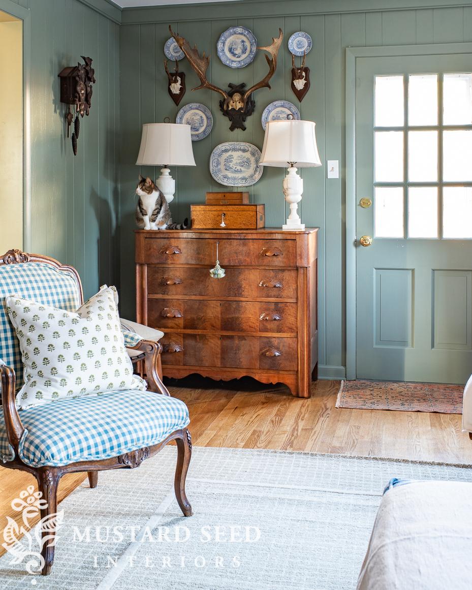 antique plates and antlers wall arrangement | miss mustard seed
