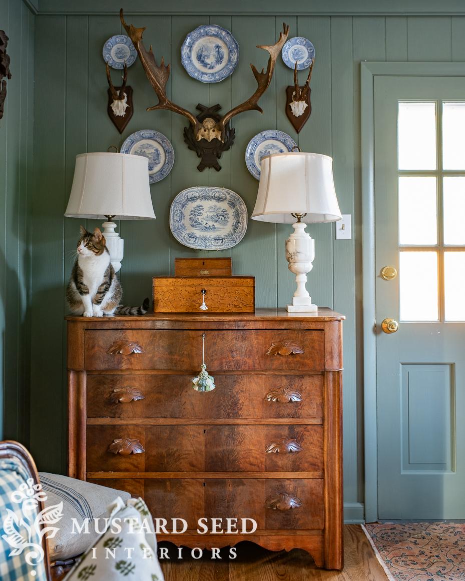 antique plates and antlers wall arrangement | miss mustard seed
