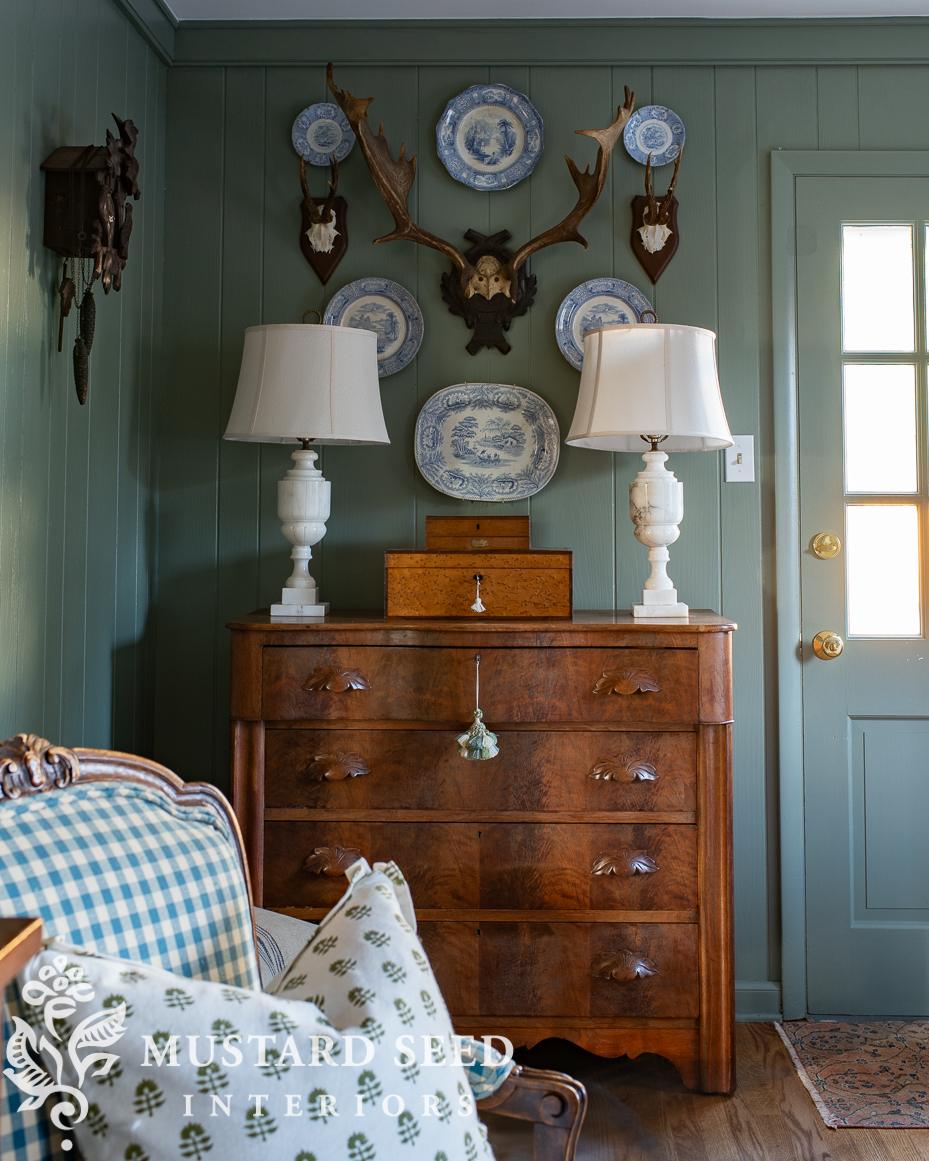 antique plates and antlers wall arrangement | miss mustard seed