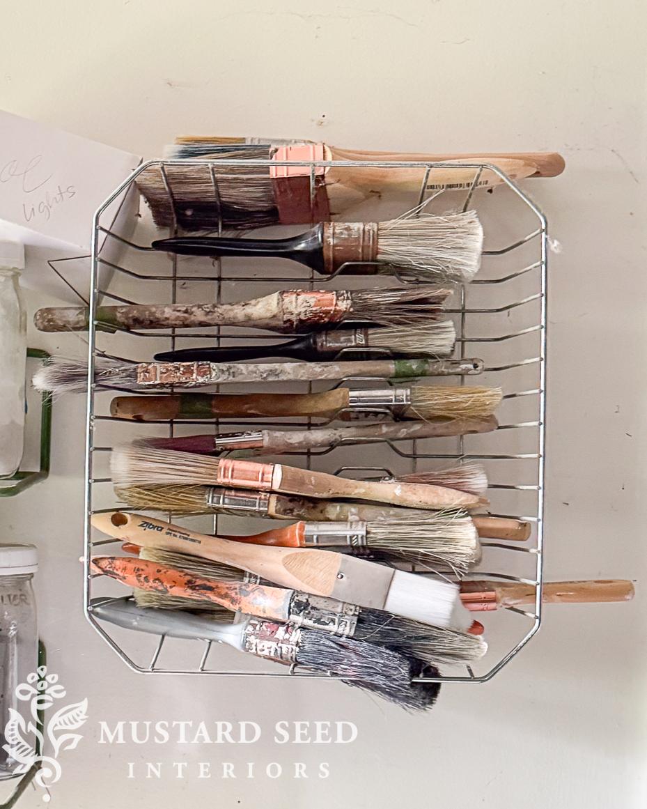 storing brushes in old dish drainer | miss mustard seed