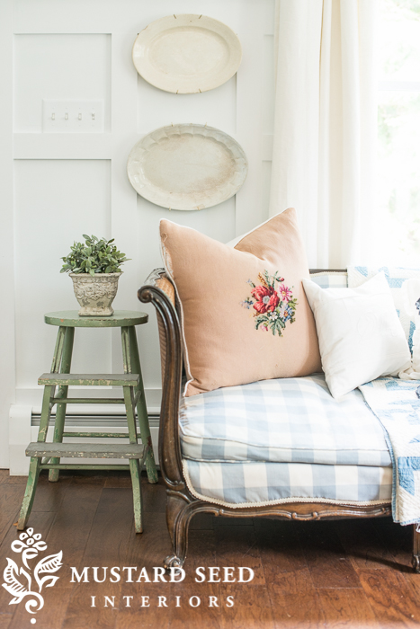 French day bed | vintage painted stool | ironstone platters | needlepoint pillow