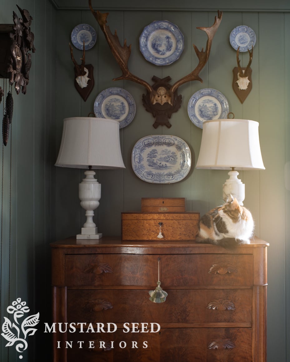 antlers and plates wall arrangement | card room green | living room decorating | antiques | miss mustard seed