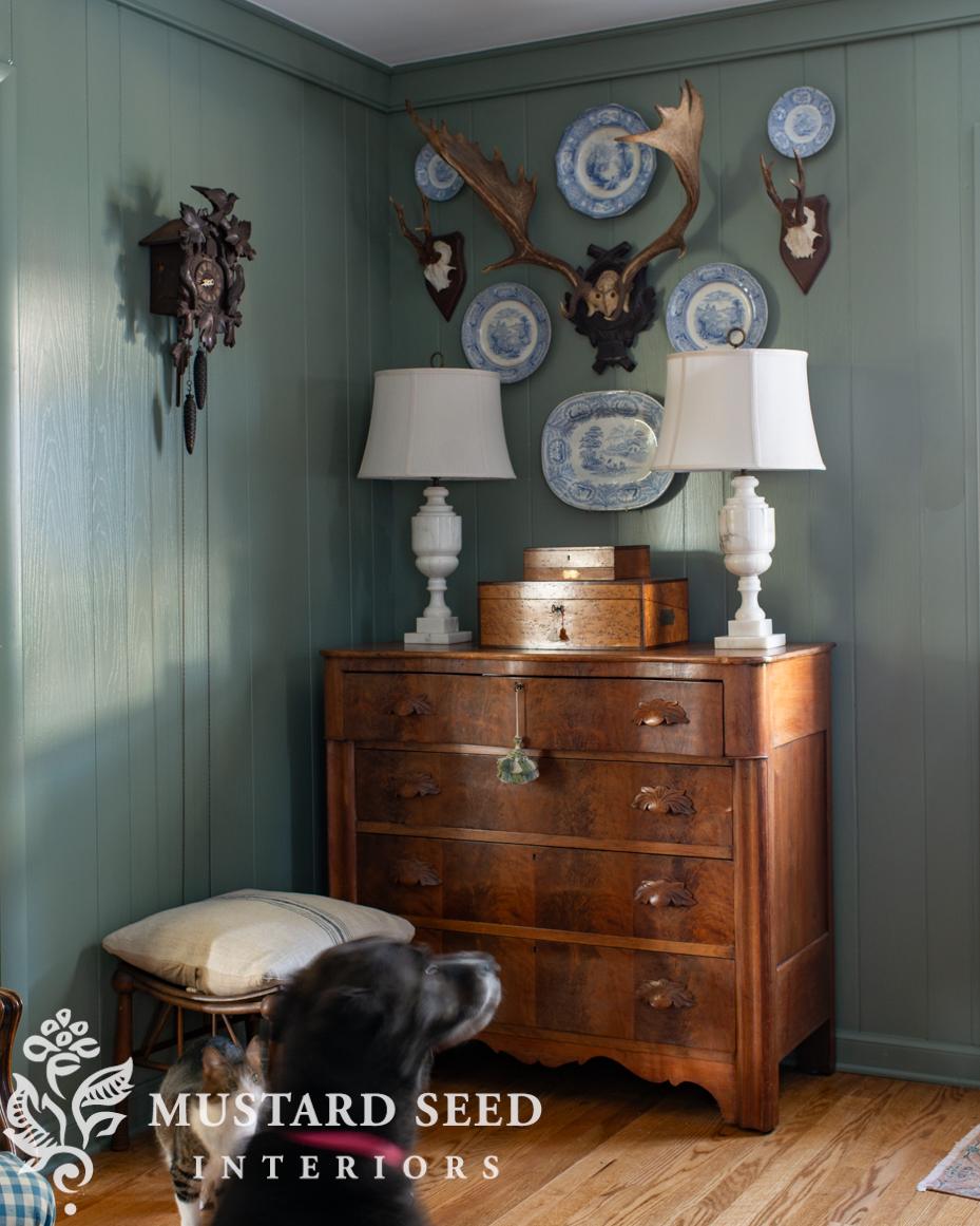 antique plates and antlers wall arrangement | miss mustard seed
