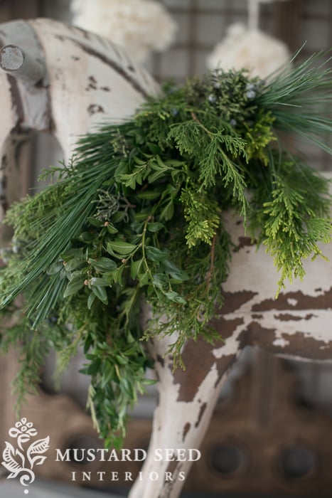 christmas decorating | dressing a chandelier with greenery | miss mustard seed